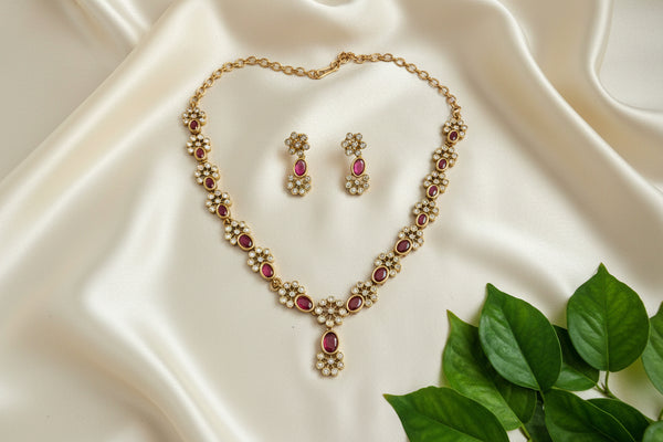 Lavanya Golden Necklace Set with Pink Stones And AD Floral Design