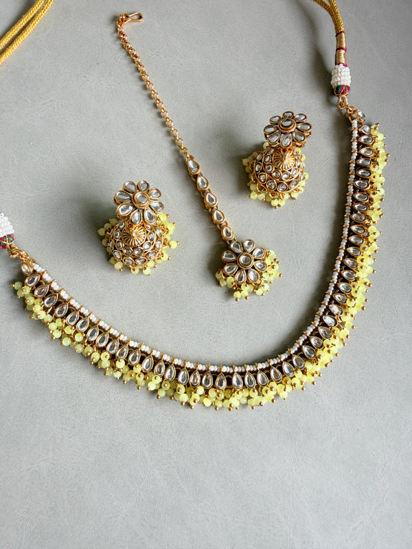 Adhira Kundan With Yellow Beads Necklace With Maangtika